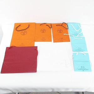 エルメス HERMES 14枚セット 紙袋 ショッパー ショップ袋 純正 付属品 ロゴ デザイン違い サイズ違い カルティエ Cartier / ヴァンクリーフ＆アーペル Van Cleef & Arpels / ティファニー TIFFANY & CO. / ルイヴィトン LOUIS VUITTON / クレ・ド・ポー ボーテ cle de peau / ローラメルシエ LAURA MERCIER オレンジ系 その他