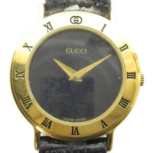 グッチ GUCCI ジャンク品 3000.2.L 腕時計 ウォッチ クォーツ レザーベルト 黒文字盤 ロゴ ゴールド色 ■GY18 /MQ レディース